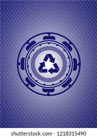 recycle icon inside badge with denim texture