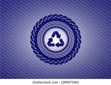 recycle icon inside badge with denim texture