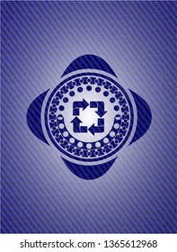 recycle icon inside badge with denim texture