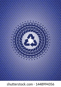 recycle icon inside badge with denim texture