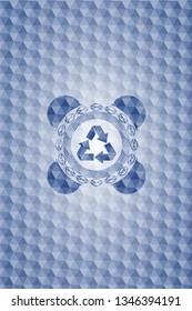 recycle icon inside blue emblem with geometric pattern.