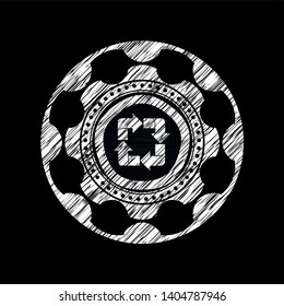 recycle icon inside chalk emblem written on a blackboard