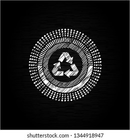 recycle icon inside chalkboard emblem written on a blackboard