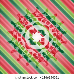 recycle icon inside christmas emblem.