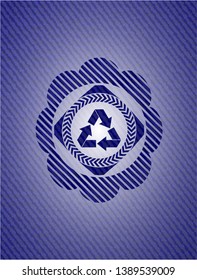 recycle icon inside denim background
