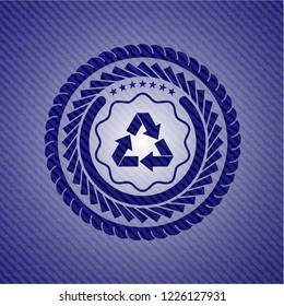 recycle icon inside emblem with denim high quality background