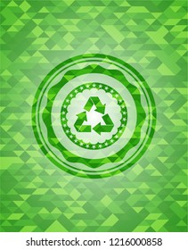 recycle icon inside green emblem with mosaic ecological style background