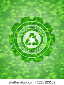 recycle icon inside green emblem with mosaic ecological style background