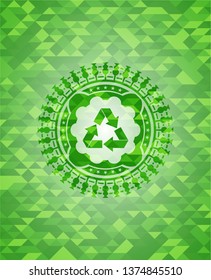 recycle icon inside green emblem with mosaic ecological style background