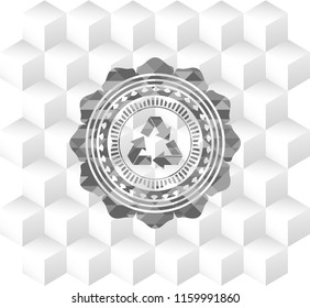 recycle icon inside grey badge with geometric cube white background