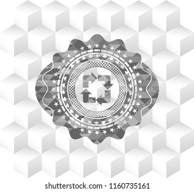 recycle icon inside grey badge with geometric cube white background