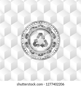 recycle icon inside grey badge with geometric cube white background