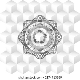 recycle icon inside grey badge with geometric cube white background. 