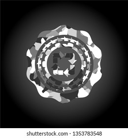 recycle icon inside grey camo emblem