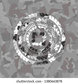 recycle icon inside grey camo texture