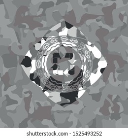 recycle icon inside grey camouflage texture