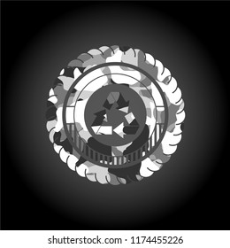 recycle icon inside grey camouflaged emblem