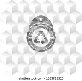 recycle icon inside grey emblem with geometric cube white background
