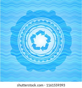 recycle icon inside light blue water wave badge background.