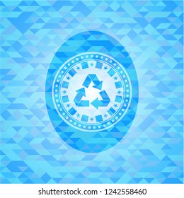 recycle icon inside light blue emblem with triangle mosaic background