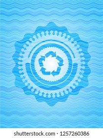 recycle icon inside light blue water wave badge.