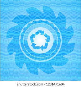 recycle icon inside light blue water emblem background.
