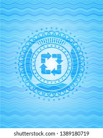 recycle icon inside light blue water emblem.