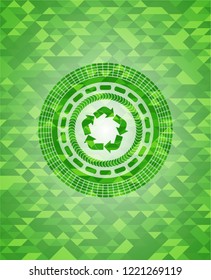 recycle icon inside realistic green mosaic emblem