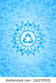 recycle icon inside realistic light blue mosaic emblem