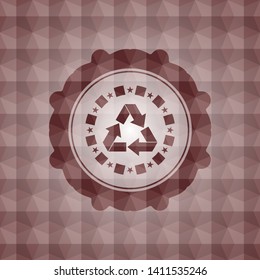 recycle icon inside red seamless emblem with geometric background.