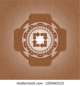 recycle icon inside retro style wooden emblem