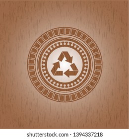 recycle icon inside retro style wood emblem