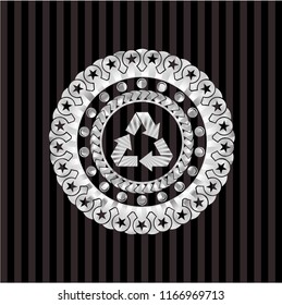 recycle icon inside silver badge or emblem