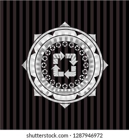recycle icon inside silver badge or emblem