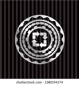 recycle icon inside silver badge or emblem