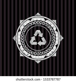 recycle icon inside silver badge or emblem