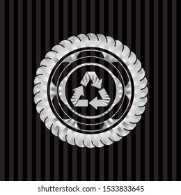 recycle icon inside silver badge or emblem
