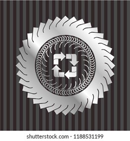 recycle icon inside silver emblem