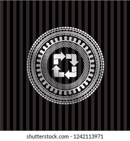 recycle icon inside silver emblem