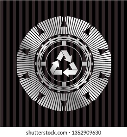recycle icon inside silver emblem or badge