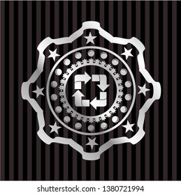 recycle icon inside silver emblem