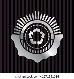recycle icon inside silver emblem