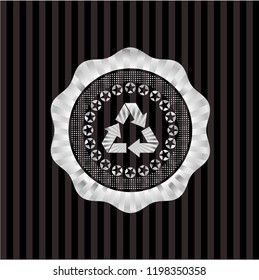recycle icon inside silver shiny emblem