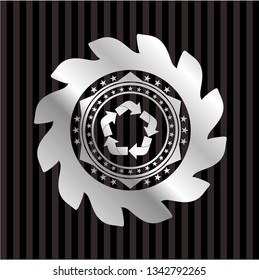 recycle icon inside silver shiny emblem
