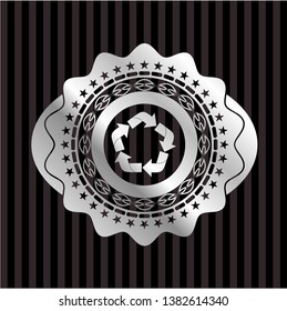 recycle icon inside silver shiny badge