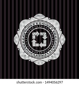 recycle icon inside silver shiny emblem