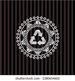 recycle icon inside silvery badge or emblem