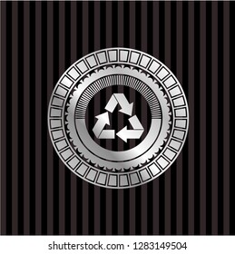 recycle icon inside silvery badge or emblem