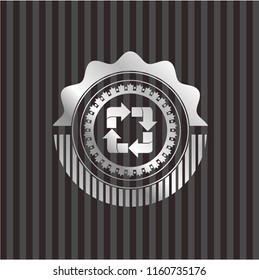 recycle icon inside silvery emblem