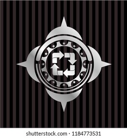 recycle icon inside silvery emblem